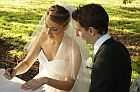 Antoine and Sarah signing the registry.